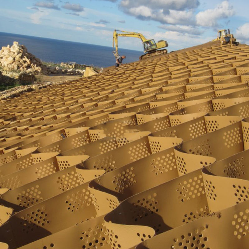 টেক্সচার্ড এবং ছিদ্রযুক্ত HDPE প্লাস্টিক জিওসেল গ্রিড যা ড্রাইভওয়ের স্থিতিশীলতা, রাস্তার ভিত্তি শক্তিশালীকরণ, পার্কিং লট এবং ঢাল রক্ষার জন্য ব্যবহৃত হয়