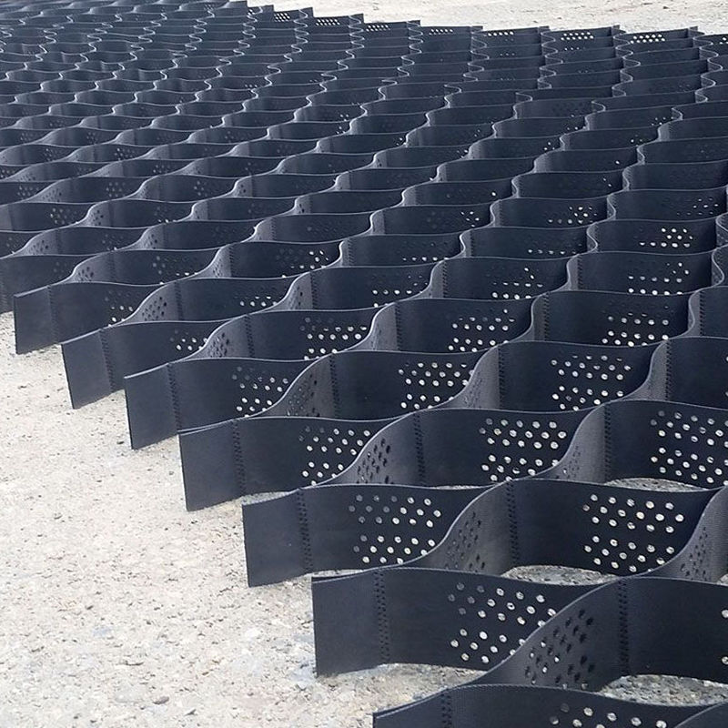 টেক্সচার্ড এবং ছিদ্রযুক্ত HDPE প্লাস্টিক জিওসেল গ্রিড যা ড্রাইভওয়ের স্থিতিশীলতা, রাস্তার ভিত্তি শক্তিশালীকরণ, পার্কিং লট এবং ঢাল রক্ষার জন্য ব্যবহৃত হয়